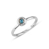 White Gold Solitaire Ring featuring a single blue diamond