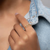 Close-up of 14K gold bay leaf ring with zircon