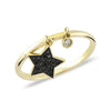 Close-up of star design with sparkling zirconia stone on solid gold ring