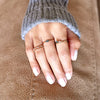 Close-up of 14K gold ring with blue diamond for festive season