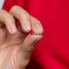 Close-up of 14K solid gold ring with blue diamonds